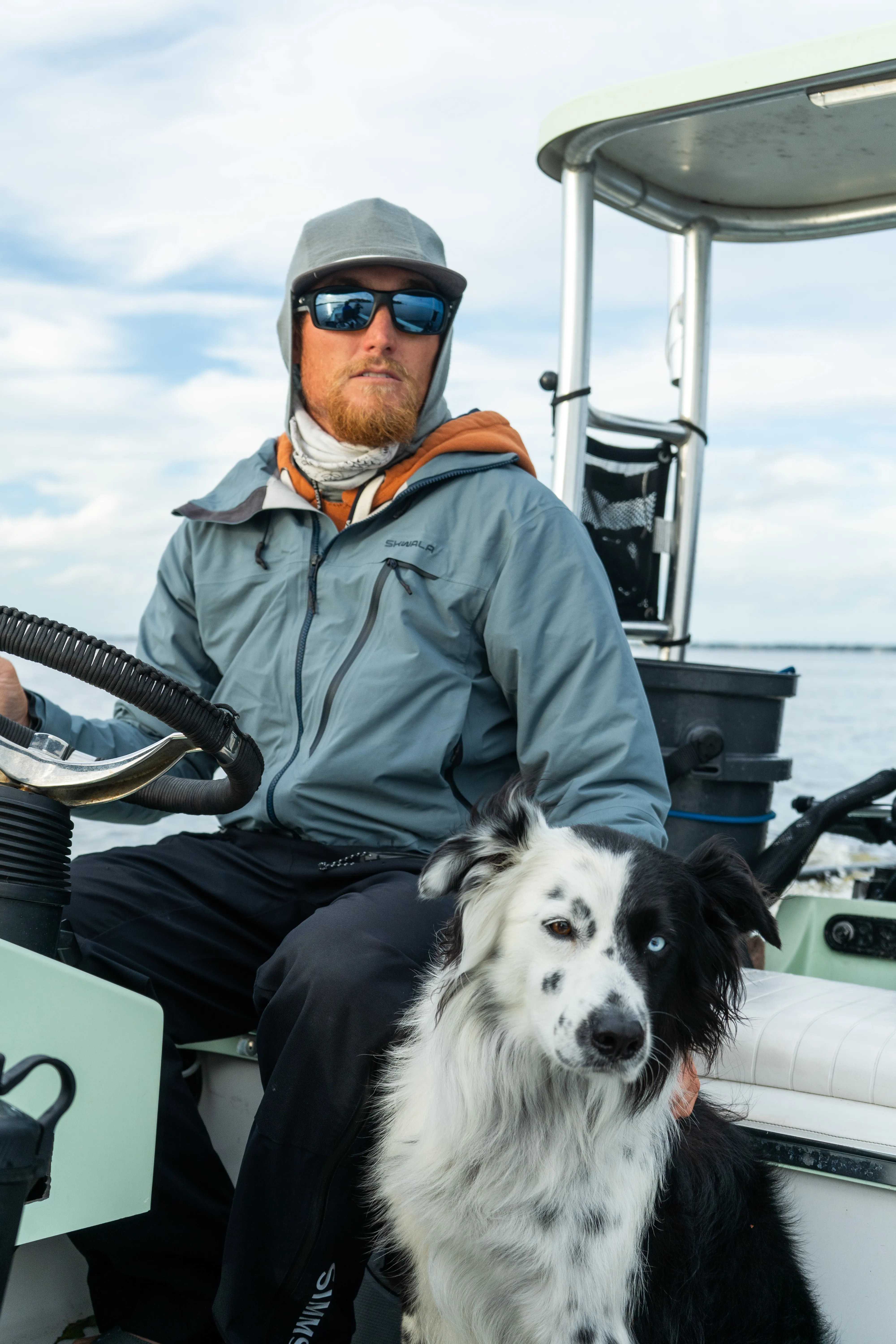 Capt. Colton at the helm with his dog
