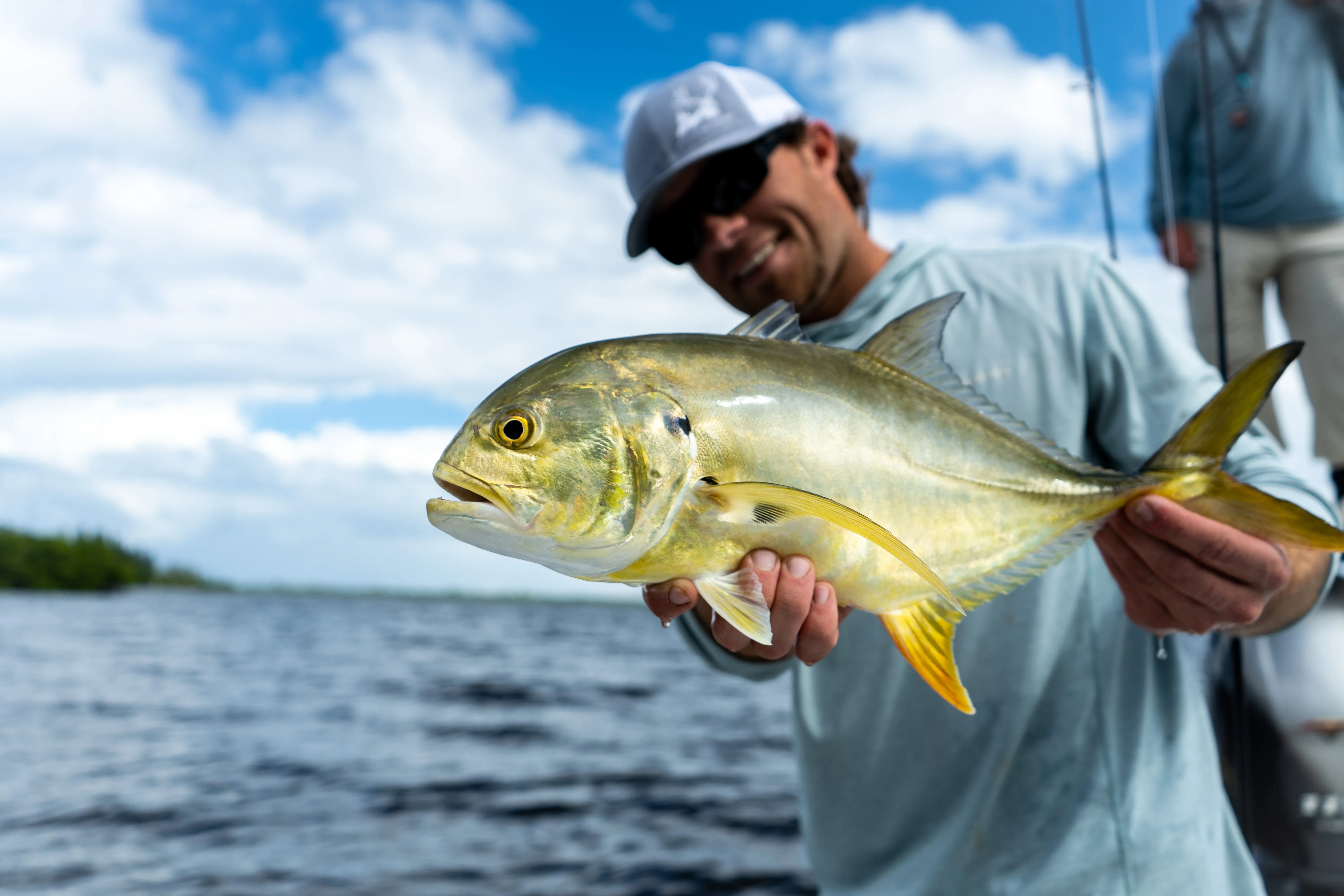 Client holding a jack crevalle boatside